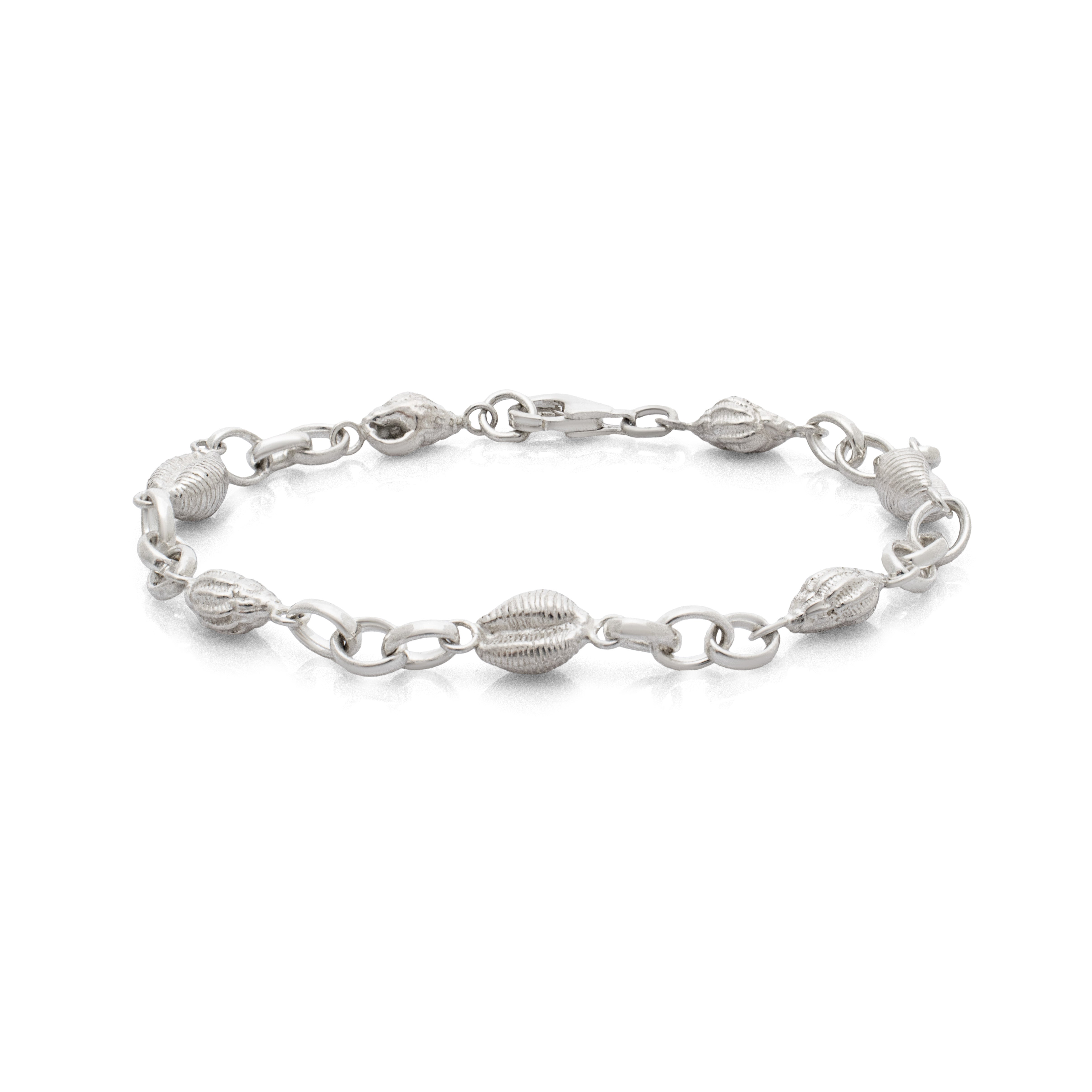 Langland bracelet. Langland Bay, Gower. Gower jewellery. Cowrie shell jewellery. Cowrie shell bracelet. Welsh jewellery. Shell bracelet. Silver shell bracelet. Welsh shell jewellery. Silver shell jewellery. Gold shell jewellery. Those Happy Places. Serena Ansell Jewellery.