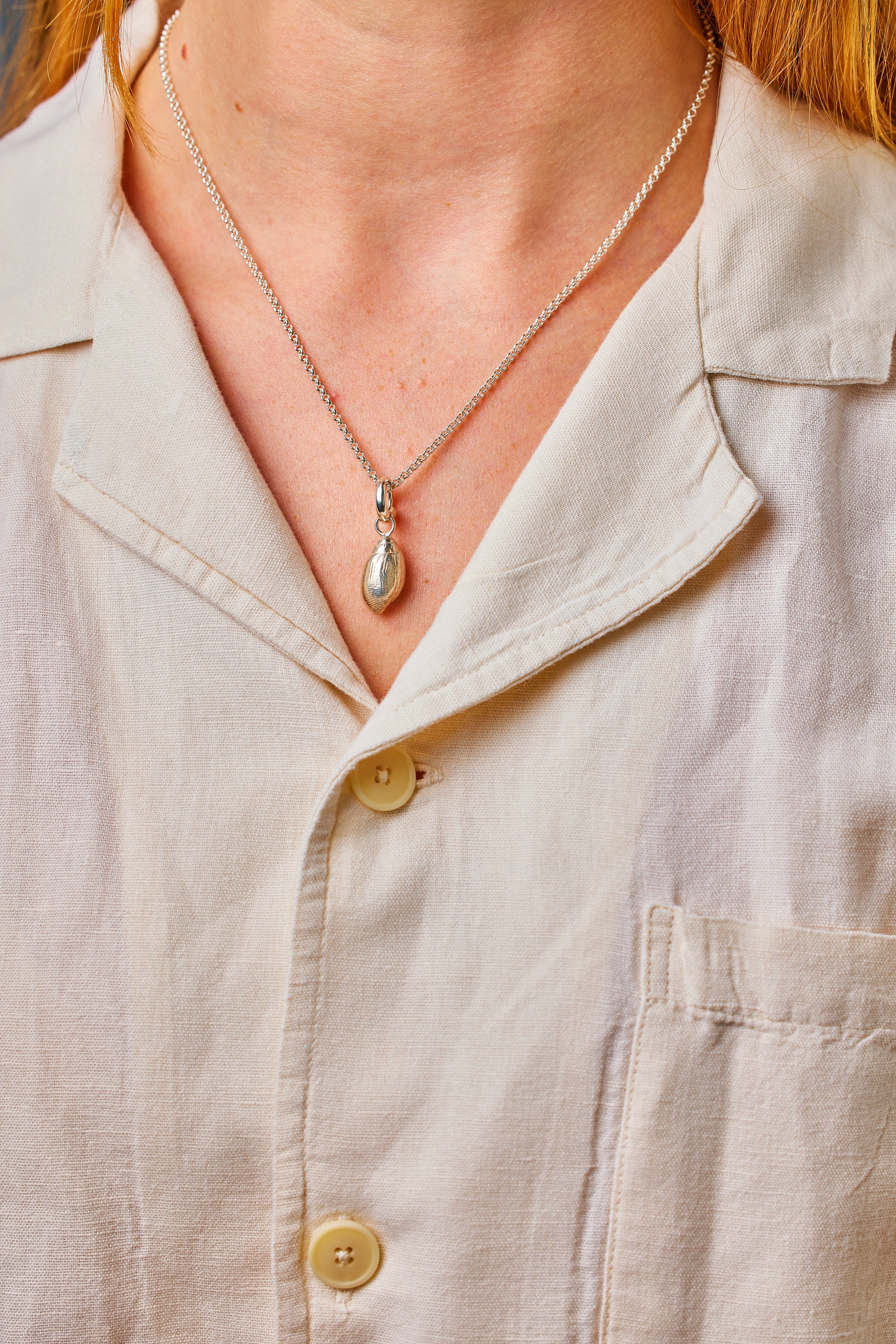 Rhossili pendant. Rhossili charm. Rhossili necklace. Rhossili Bay, Wales. Welsh jewellery. Gower jewellery. Wales shell jewellery. Silver shell jewellery. Gold shell jewellery. Those Happy Places. Serena Ansell Jewellery.