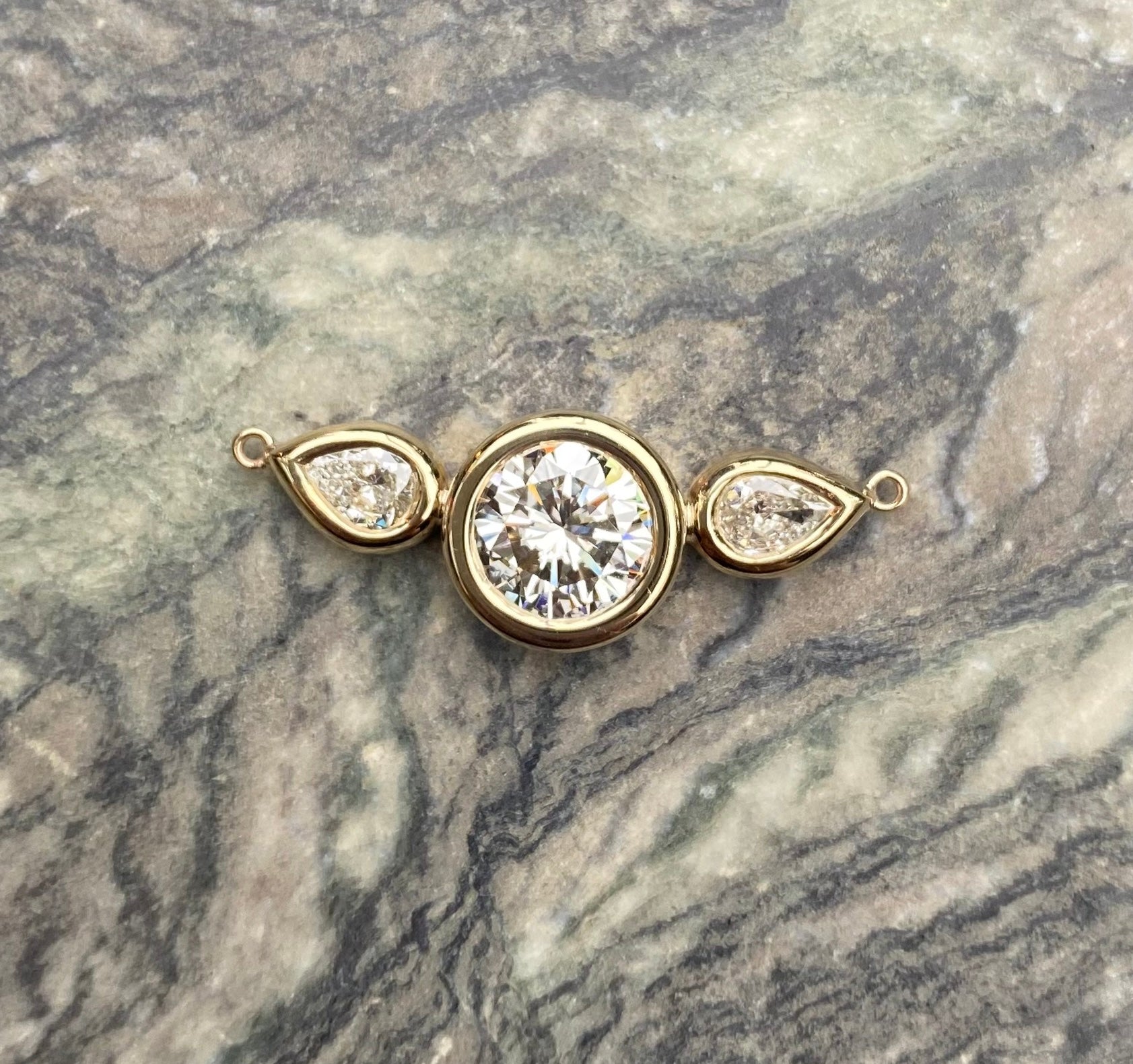 Repurposed engagement ring. Engagement ring redesign. Diamond pendant. Bespoke jewellery design. Old jewellery redesign. Bespoke jeweller London.