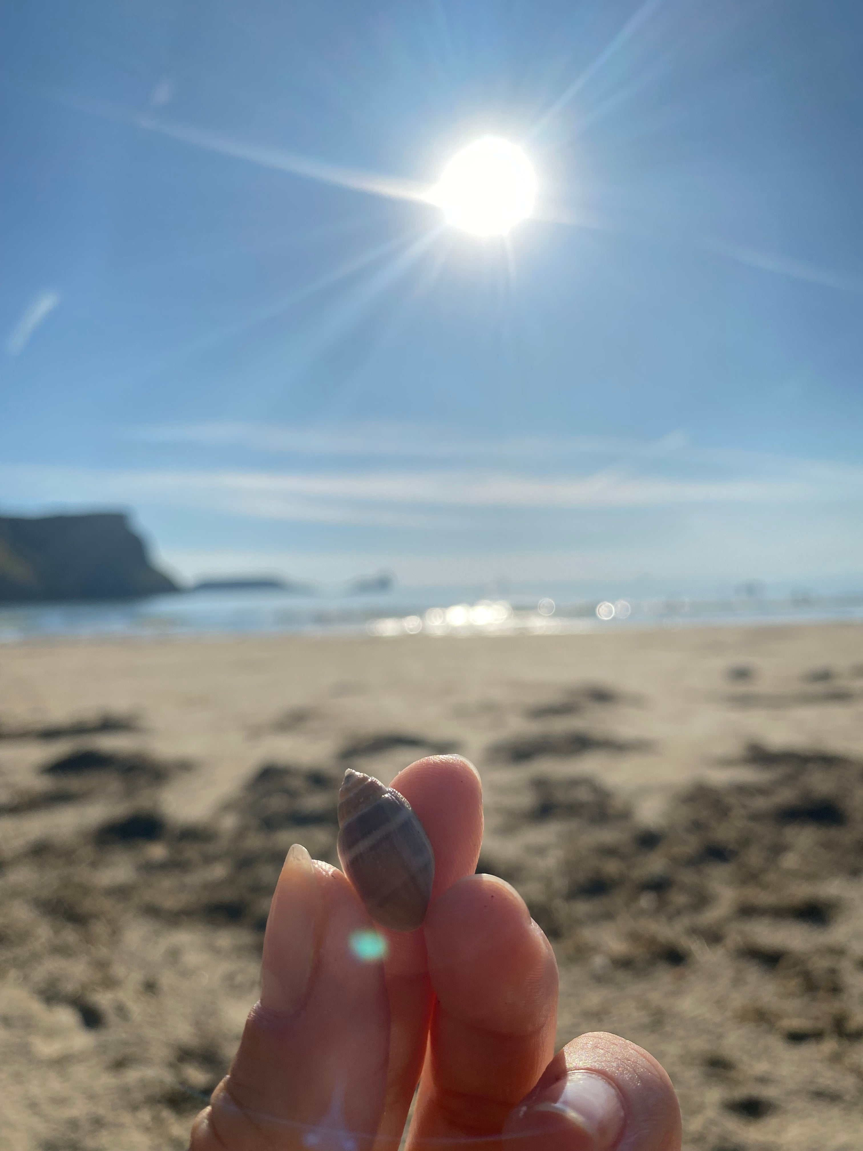 Rhossili pendant. Rhossili charm. Rhossili necklace. Rhossili Bay, Wales. Welsh jewellery. Gower jewellery. Wales shell jewellery. Silver shell jewellery. Gold shell jewellery. Those Happy Places. Serena Ansell Jewellery.