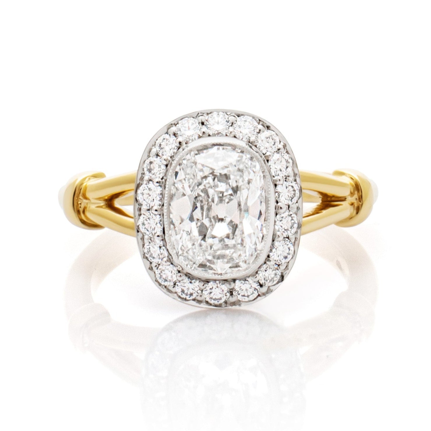 Antique Diamond engagement ring. Old cut Diamond engagement ring. Cushion Diamond engagement ring. Diamond halo engagement ring. Bespoke engagement ring. Bespoke engagement ring designer. Bespoke engagement ring London. Diamond cluster ring. Split shank engagement ring. Engagement ring with split band. Engagement ring with knots on the band.