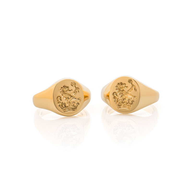 A pair of 18 carat gold Signet Rings hand-engraved with a demi-lion rampant Gules holding a primrose in his dexter paw