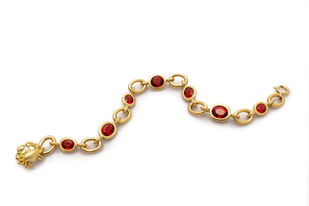 Natural red spinel and solid gold bracelet. Serena Ansell bespoke jewellery design. Bespoke jewellery designer London. 