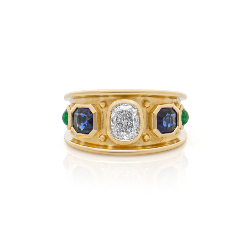 A cushion cut Diamond, Sapphire & Colombian Emerald Classical Ring