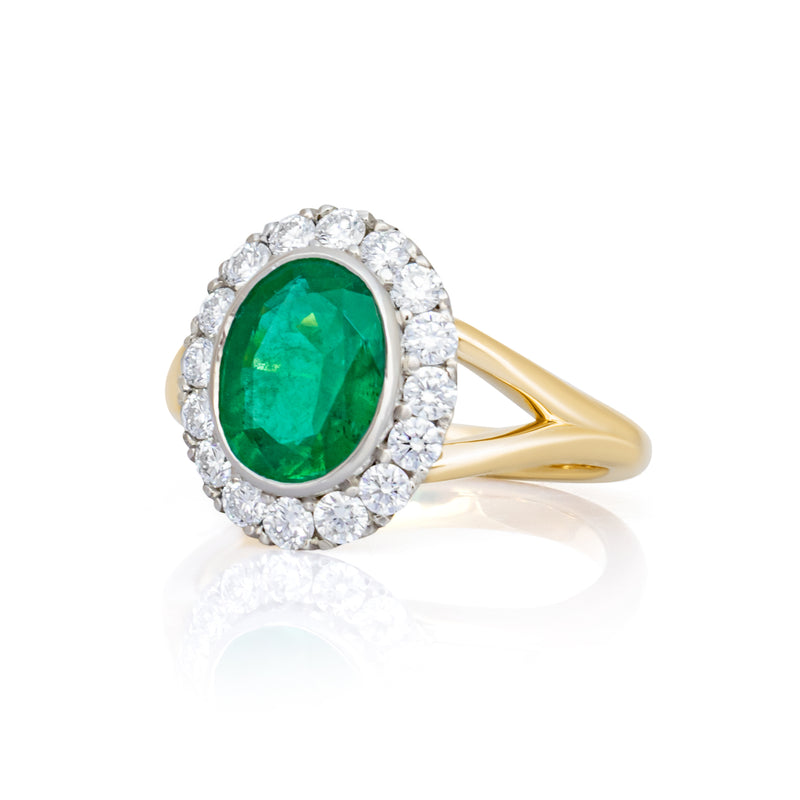 An Emerald & Diamond Halo Ring