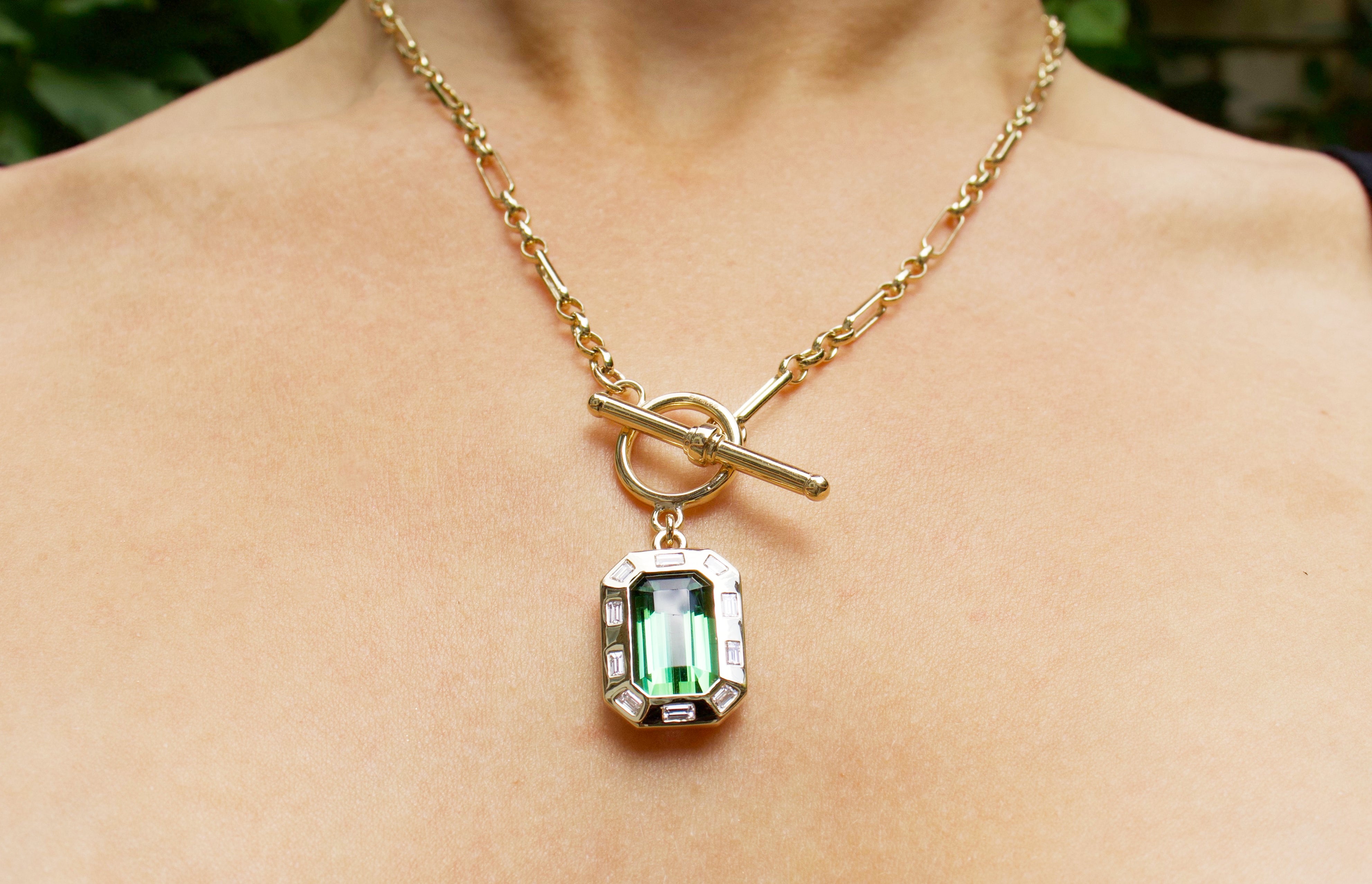 Green tourmaline t-bar necklace. Signature t-bar necklace. Green tourmaline necklace. Green gemstone necklace. Green tourmaline and diamonds. Green gemstone pendant necklace. Serena Ansell T-bar necklace. Solid gold necklace. Fine jewellery London. Serena Ansell Jewellery. 